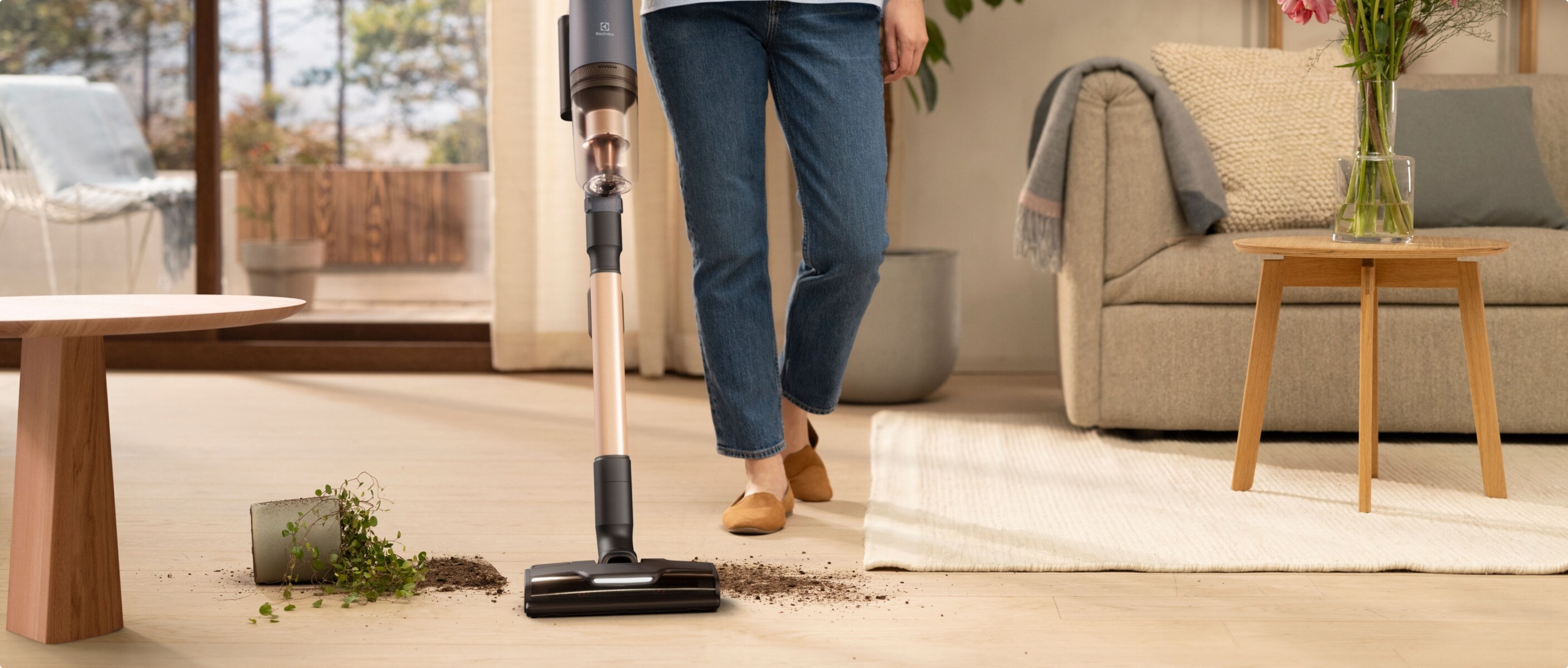 Woman vacuuming in a living room.